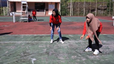 group of people are playing team working Game to build a teamwork, Semarang Indonesia, December 17, 2022