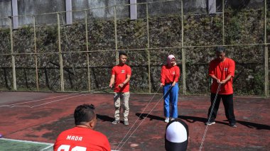 group of people are playing team working Game to build a teamwork, Semarang Indonesia, December 17, 2022