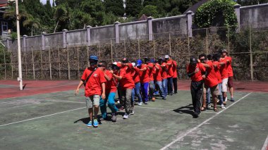 group of people are playing team working Game to build a teamwork, Semarang Indonesia, December 17, 2022