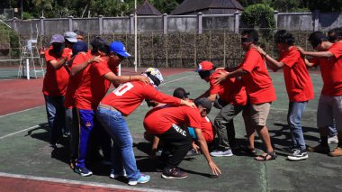 group of people are playing team working Game to build a teamwork, Semarang Indonesia, December 17, 2022
