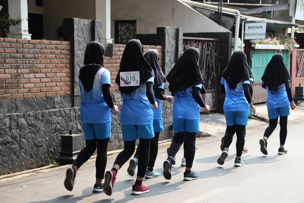 stock image Group of participants for a walking competition in commemoration of Indonesia's independence day Batang Indonesia August 27th 2020