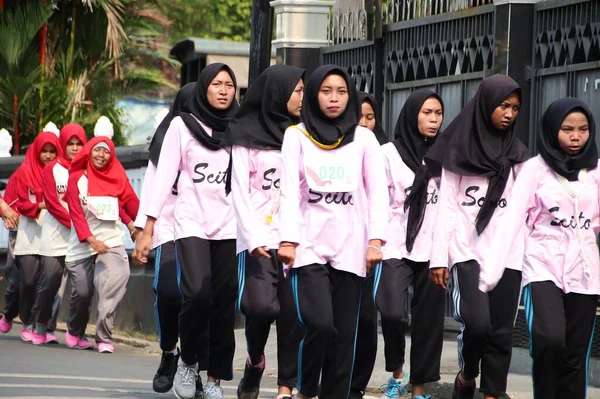 stock image Group of participants for a walking competition in commemoration of Indonesia's independence day Batang Indonesia August 27th 2020