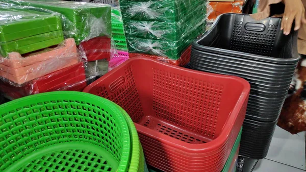 Cheap plastic household items for sale on the market close up Environment pollution concept