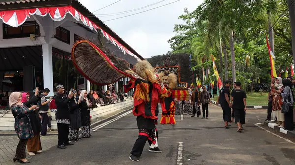 stock image Traditional Dance from is called REOG, masked dancers resembling large tiger decorated with peacock tail feathers, Batang Indonesia April 25 2024