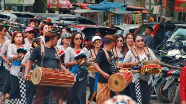 Cremation ceremony or Ngaben in Bali. People carry a wooden container (a temple-like structure with a coffin on top) to the grave. clipart