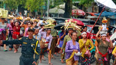 Cremation ceremony or Ngaben in Bali. People carry a wooden container (a temple-like structure with a coffin on top) to the grave. clipart