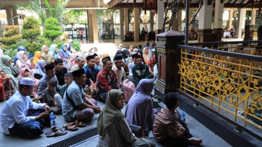 Many Muslim people make a pilgrimage to Gus Dur's or Abbdurahaman Wahid grave and pray, Jombang June 19 2024 clipart