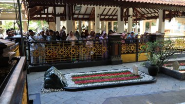 Many Muslim people make a pilgrimage to Gus Dur's or Abbdurahaman Wahid grave and pray, Jombang June 19 2024 clipart