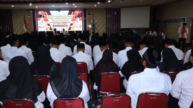 Government Employees with Work Agreements. Indonesian State Civil Apparatus during a meeting, Pekalongan February 27 2024 clipart