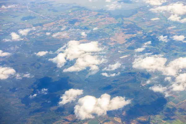 stock image Aerial view of mountains, rivers, clouds, Agricultural Landscape areas the green and yellow rice field, Aerial view of grew in different pattern, And housing.Remote viewing.