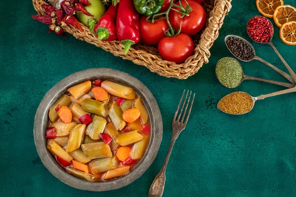 Leek dish with olive oil. Zeytinyagli pirasa . Suitable for vegans. Leek meal in the copper bowl.