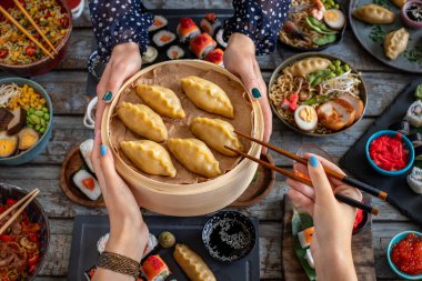 Gyoza jiaozi dumpling in the bamboo steamer  clipart