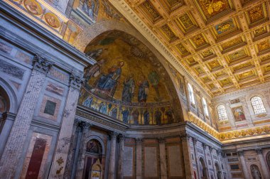 The Papal Basilica of Saint Paul Outside the Walls is one of the four papal basilicas of Rome. It rises along the Via Ostiense, in the district of the same name, near the left bank of the Tiber.