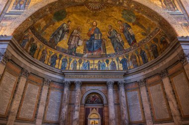 The Papal Basilica of Saint Paul Outside the Walls is one of the four papal basilicas of Rome. It rises along the Via Ostiense, in the district of the same name, near the left bank of the Tiber.