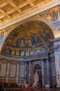 The Papal Basilica of Saint Paul Outside the Walls is one of the four papal basilicas of Rome. It rises along the Via Ostiense, in the district of the same name, near the left bank of the Tiber.