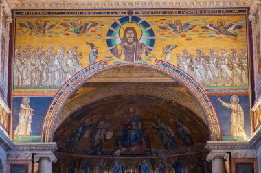 The Papal Basilica of Saint Paul Outside the Walls is one of the four papal basilicas of Rome. It rises along the Via Ostiense, in the district of the same name, near the left bank of the Tiber.