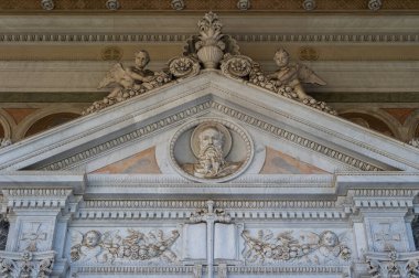 The Papal Basilica of Saint Paul Outside the Walls is one of the four papal basilicas of Rome. It rises along the Via Ostiense, in the district of the same name, near the left bank of the Tiber.