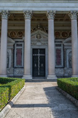 The Papal Basilica of Saint Paul Outside the Walls is one of the four papal basilicas of Rome. It rises along the Via Ostiense, in the district of the same name, near the left bank of the Tiber.