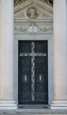 The Papal Basilica of Saint Paul Outside the Walls is one of the four papal basilicas of Rome. It rises along the Via Ostiense, in the district of the same name, near the left bank of the Tiber.