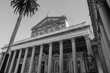 The Papal Basilica of Saint Paul Outside the Walls is one of the four papal basilicas of Rome. It rises along the Via Ostiense, in the district of the same name, near the left bank of the Tiber.