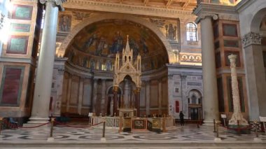 The Papal Basilica of Saint Paul Outside the Walls is one of the four papal basilicas of Rome. It rises along the Via Ostiense, in the district of the same name, near the left bank of the Tiber.