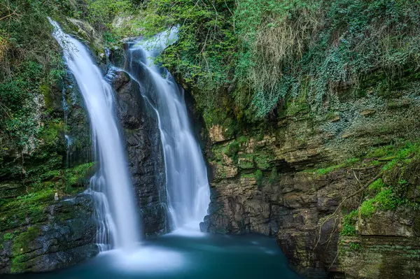 stock image In the heart of a very small village in Molise, immersed in an enchanted forest and floral nature, stands the Carpinone waterfall, one of the most fascinating spectacles of the local nature.