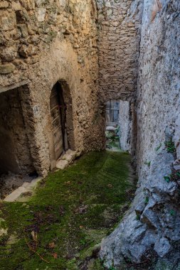 Pesche, village in the province of Isernia, in Molise, perched along the steep slopes of Mount San Marco, a white spot against the green of the mountain and the gray of the stones. clipart