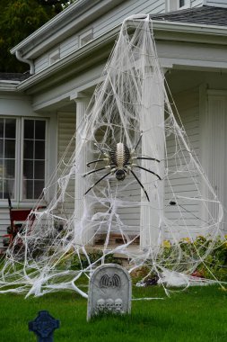 Homeowners of the community dressed up their houses and yard with scary Halloween decorations for 2022. clipart