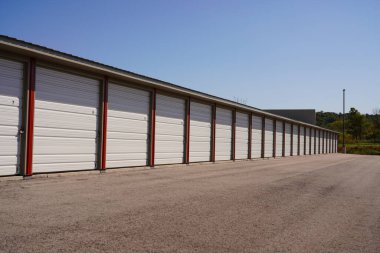 Red storage unit buildings site outside of Fond du Lac, Wisconsin holding owers property.