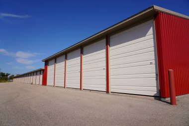 Red storage unit buildings site outside of Fond du Lac, Wisconsin holding owers property.