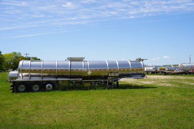 Chemical tank trailers sit outside in the countryside of Mauston, Wisconsin.