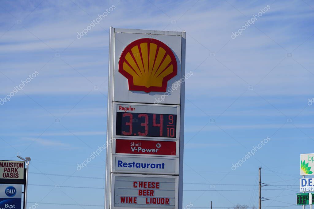 Mauston, Wisconsin USA - February 7th, 2022: Fuel prices at a Wisconsin gas stations are over 3 dollars and 30 cents due to inflation from Joe Biden administration.