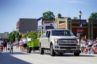 Sheboygan, Wisconsin / USA - July 4th, 2019: Many community members came out to be a spectator and watch 4th of july freedom pride festival parade marching downtown in the city. clipart