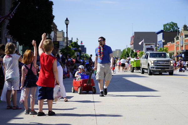 Sheboygan, Wisconsin / USA - July 4th, 2019: Many community members came out to be a spectator and watch 4th of july freedom pride festival parade marching downtown in the city