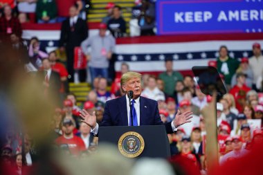 Milwaukee, Wisconsin / USA - January 14th, 2020: Donald John Trump the 45th president held a powerful conservative republican rally at UW-Milwaukee Panther Arena that filled 12,700 participants. clipart