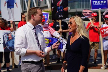Milwaukee, Wisconsin USA - August 23rd, 2023: United States Representative Marjorie Taylor Greene gave interviews with the press and media and interacted with Trump supporters at the Fiserv Forum. clipart