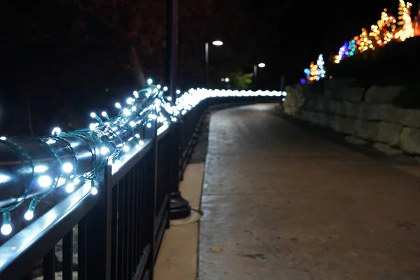 stock image Wisconsin Dells, Wisconsin USA - December 1st, 2020: Christmas lights glow up the river walk along wisconsin river