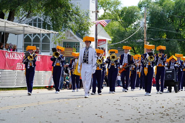 Warrens, Wisconsin USA - September 25th, 2022: Mauston High School Cheese Head marching band marched in Cranfest parade 2022.