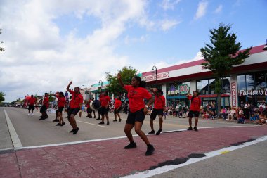 Wisconsin Dells, Wisconsin USA - September 18th, 2023: Soul Steppers drill team performed in the streets during Wo Zha Wa festival parade clipart