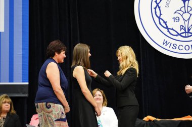  Wisconsin ABD - Wisconsin 'deki Marian Üniversitesi' nde mezuniyet kutlaması, tutkuları eyleme dönüştürme ve ilham verme amaçlı bir eğitim sunan özel bir Katolik Üniversitesi 'dir.