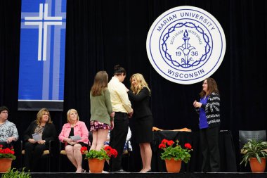  Wisconsin ABD - Wisconsin 'deki Marian Üniversitesi' nde mezuniyet kutlaması, tutkuları eyleme dönüştürme ve ilham verme amaçlı bir eğitim sunan özel bir Katolik Üniversitesi 'dir.