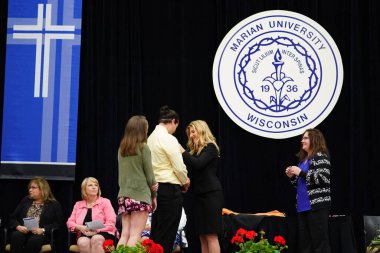  Wisconsin ABD - Wisconsin 'deki Marian Üniversitesi' nde mezuniyet kutlaması, tutkuları eyleme dönüştürme ve ilham verme amaçlı bir eğitim sunan özel bir Katolik Üniversitesi 'dir.