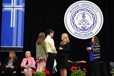  Wisconsin ABD - Wisconsin 'deki Marian Üniversitesi' nde mezuniyet kutlaması, tutkuları eyleme dönüştürme ve ilham verme amaçlı bir eğitim sunan özel bir Katolik Üniversitesi 'dir.