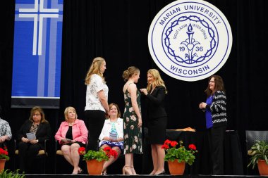 Wisconsin ABD - Wisconsin 'deki Marian Üniversitesi' nde mezuniyet kutlaması, tutkuları eyleme dönüştürme ve ilham verme amaçlı bir eğitim sunan özel bir Katolik Üniversitesi 'dir.