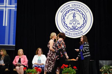  Wisconsin ABD - Wisconsin 'deki Marian Üniversitesi' nde mezuniyet kutlaması, tutkuları eyleme dönüştürme ve ilham verme amaçlı bir eğitim sunan özel bir Katolik Üniversitesi 'dir.