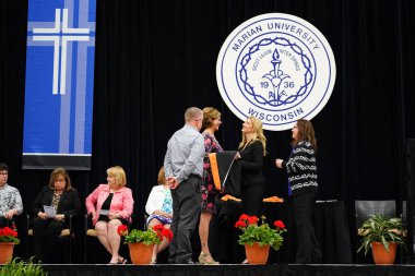  Wisconsin ABD - Wisconsin 'deki Marian Üniversitesi' nde mezuniyet kutlaması, tutkuları eyleme dönüştürme ve ilham verme amaçlı bir eğitim sunan özel bir Katolik Üniversitesi 'dir.