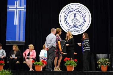  Wisconsin ABD - Wisconsin 'deki Marian Üniversitesi' nde mezuniyet kutlaması, tutkuları eyleme dönüştürme ve ilham verme amaçlı bir eğitim sunan özel bir Katolik Üniversitesi 'dir.