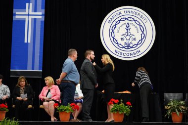  Wisconsin ABD - Wisconsin 'deki Marian Üniversitesi' nde mezuniyet kutlaması, tutkuları eyleme dönüştürme ve ilham verme amaçlı bir eğitim sunan özel bir Katolik Üniversitesi 'dir.