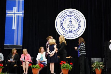  Wisconsin ABD - Wisconsin 'deki Marian Üniversitesi' nde mezuniyet kutlaması, tutkuları eyleme dönüştürme ve ilham verme amaçlı bir eğitim sunan özel bir Katolik Üniversitesi 'dir.