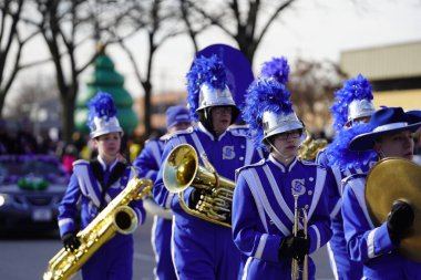 Green Bay, Wisconsin / USA - November 23rd, 2019: Vincent T. Lombardi Middle School Spartan musical marching band marched in 36th Annual Prevea Green Bay Holiday Parade hosted by Downtown Green Bay. clipart